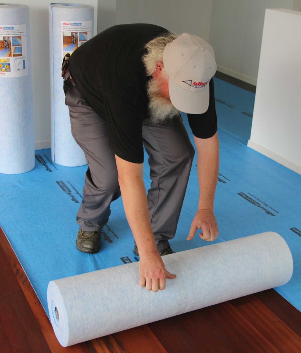 Albert Floorotex surface protection being installed over hardwood flooring
