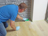 Osmo Hand Pad Holder in use on wood
